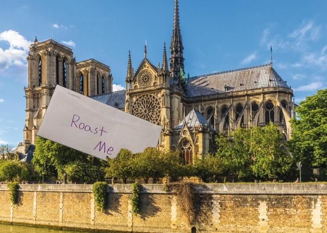 A photo of Notre Dame with a 'Roast Me' sign in front of it. Notre Dame memes.