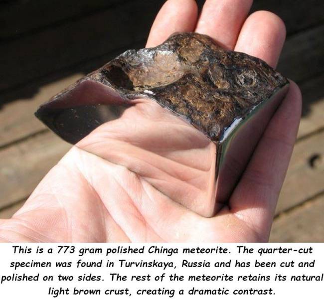 random pics - meteorite pretty - This is a 773 gram polished Chinga meteorite. The quartercut specimen was found in Turvinskaya, Russia and has been cut and polished on two sides. The rest of the meteorite retains its natural light brown crust, creating a