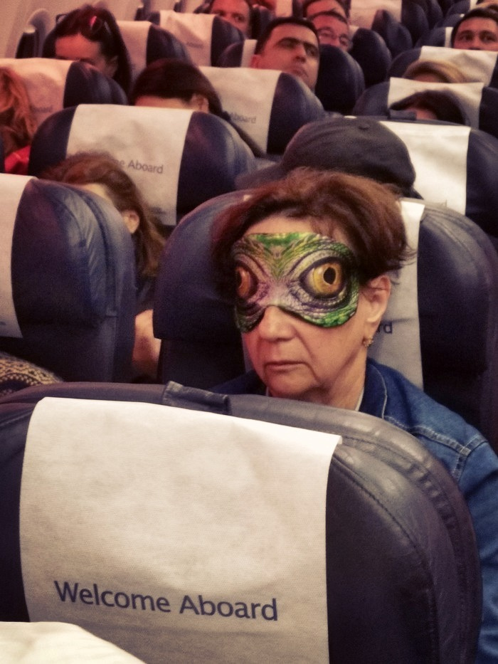 Reptilian humanoid  woman wearing reptile sleeping mask