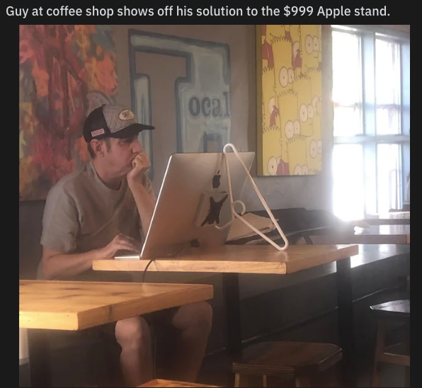 funny picture - Humour - Guy at coffee shop shows off his solution to the $999 Apple stand. 09