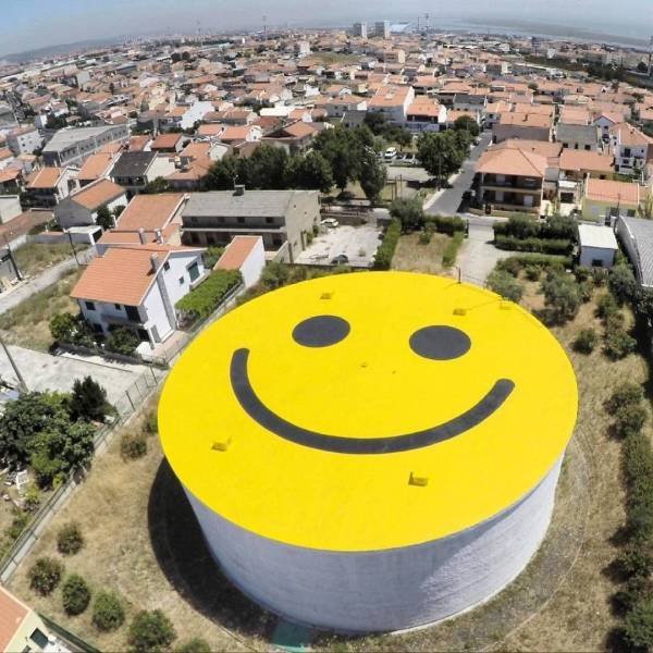 oil depot with big smiley face on it