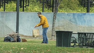 kindness animated gif people - man gives out free olive garden to homeless people