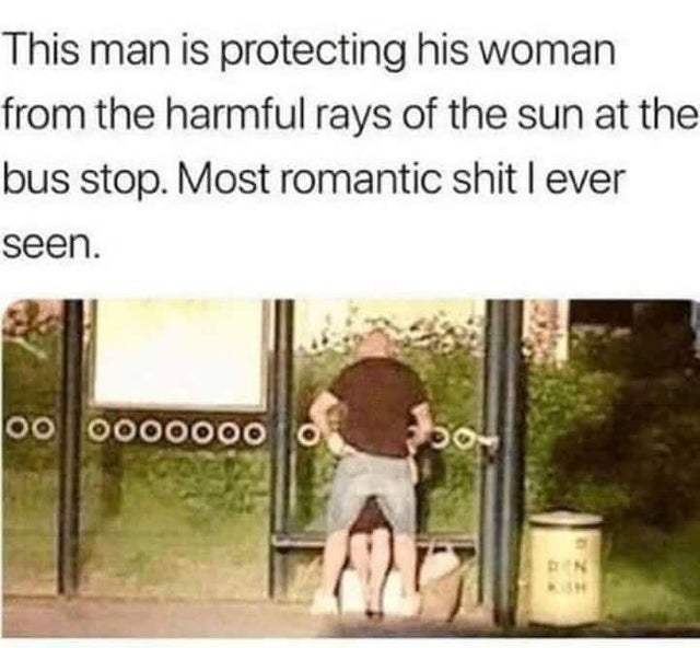This man is protecting his woman from the harmful rays of the sun at the bus stop. Most romantic shit lever seen. oo 00000000