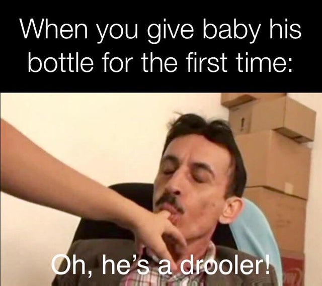 photo caption - When you give baby his bottle for the first time Oh, he's a drooler!