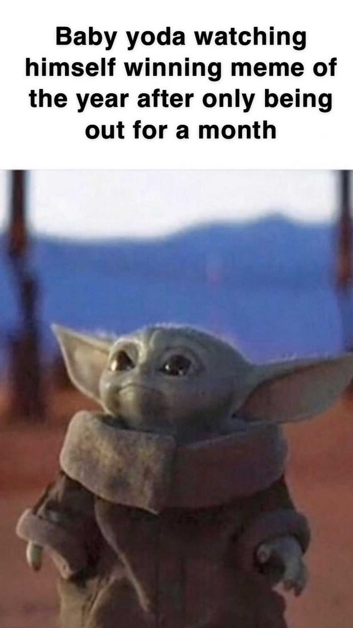 photo caption - Baby yoda watching himself winning meme of the year after only being out for a month