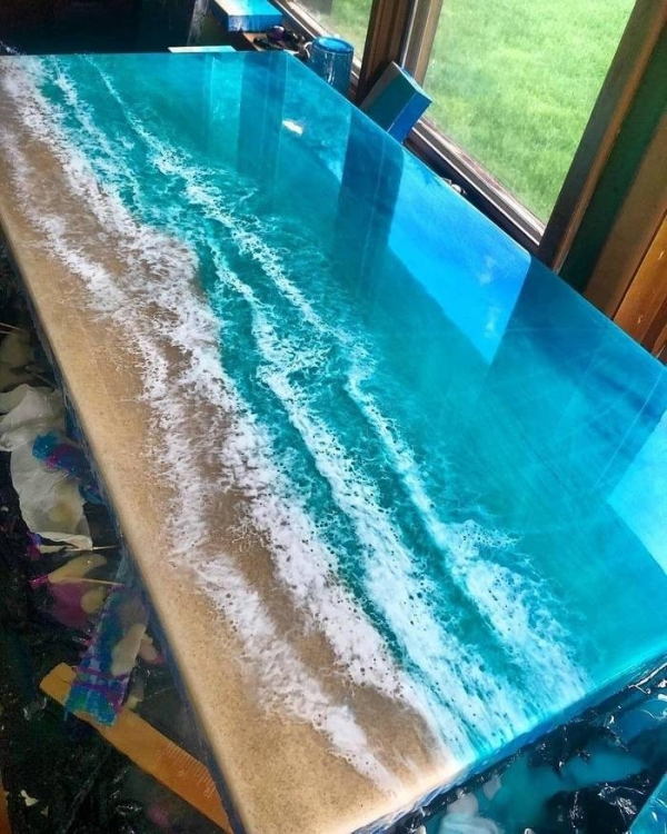 an epoxy table that looks like the ocean
