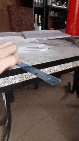 flicking a ruler gif