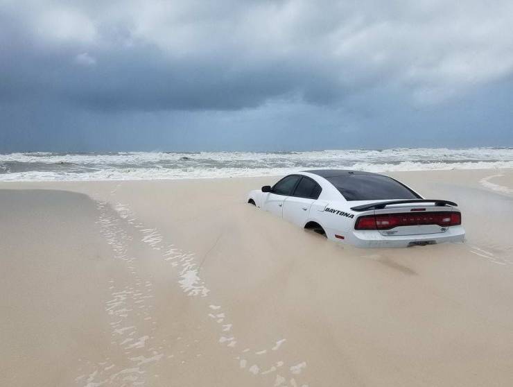 car buried in sand dauphin island