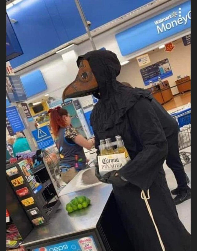 man in old fashioned plague mask buying corona beer at Walmart