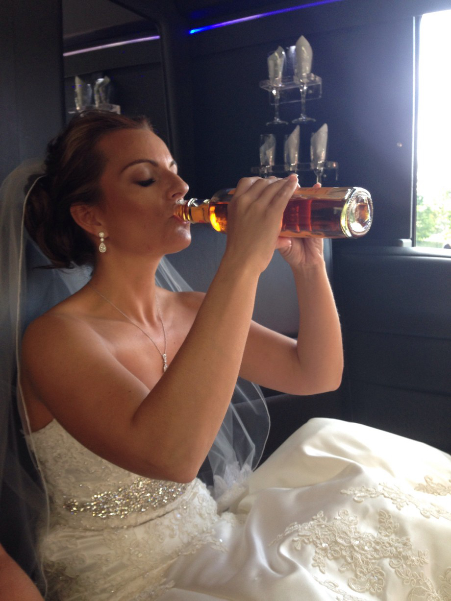 bride drinking out of the bottle