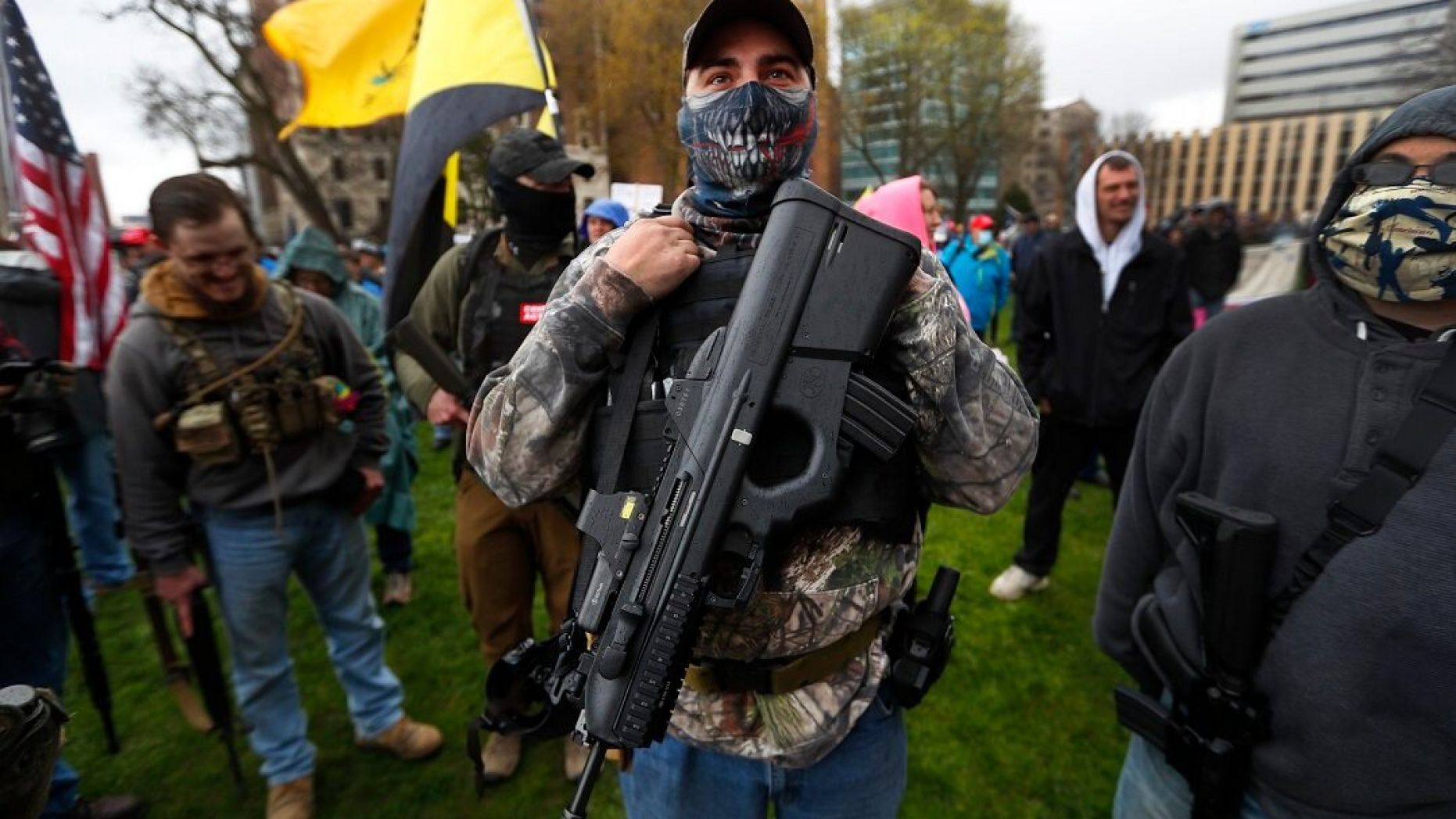 michigan protesters guns lockdown - protesters carrying guns at michigan statehouse lockdown protest