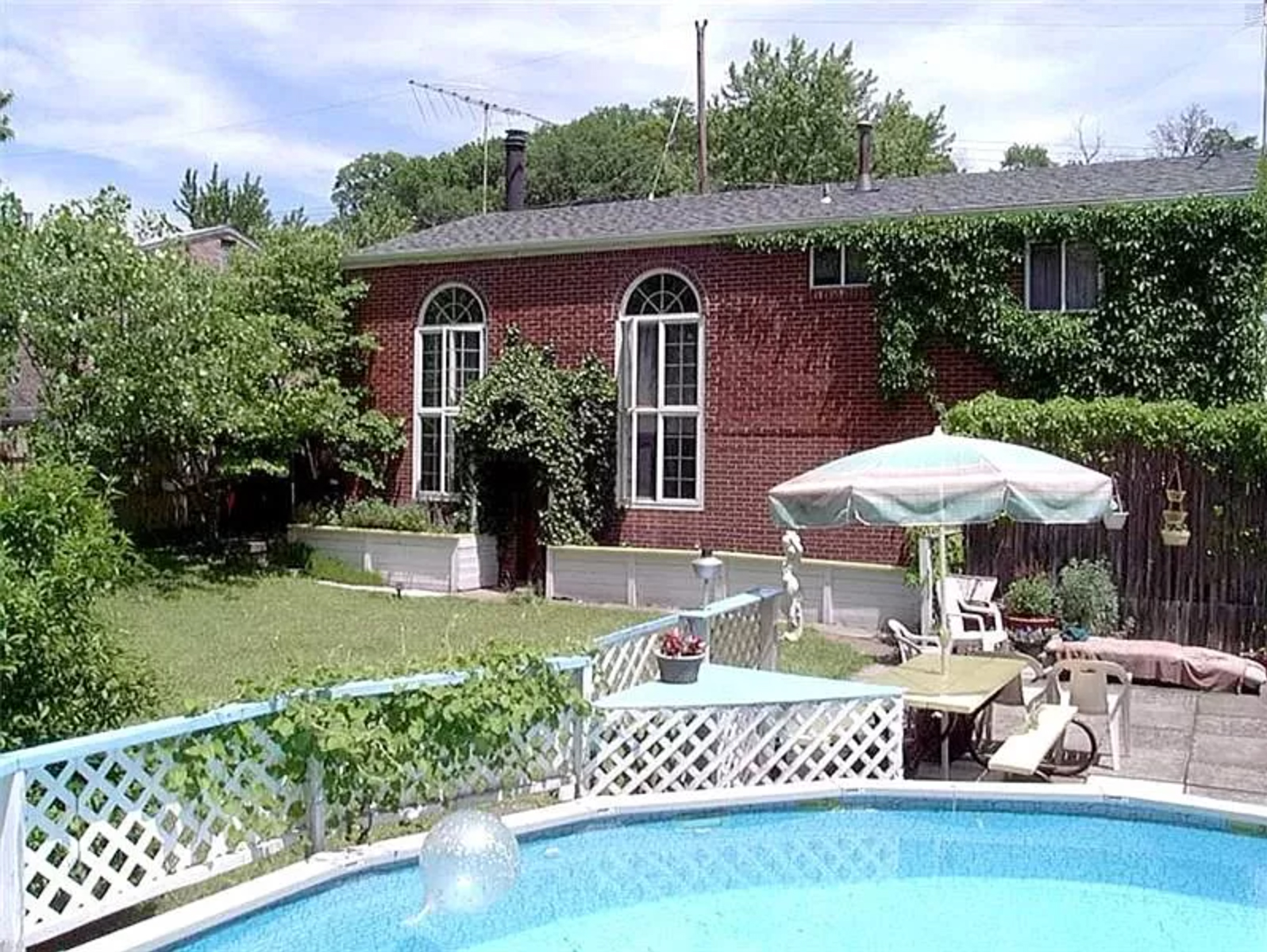backyard of house with swimming pool