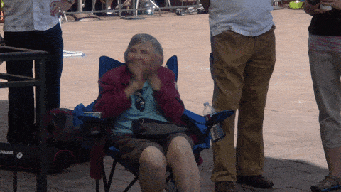 clapping grandma sitting down in chair reaction gif