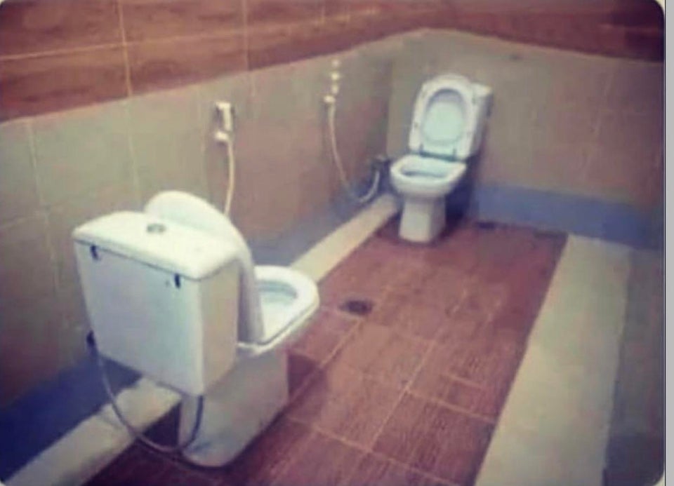 toilets facing each other
