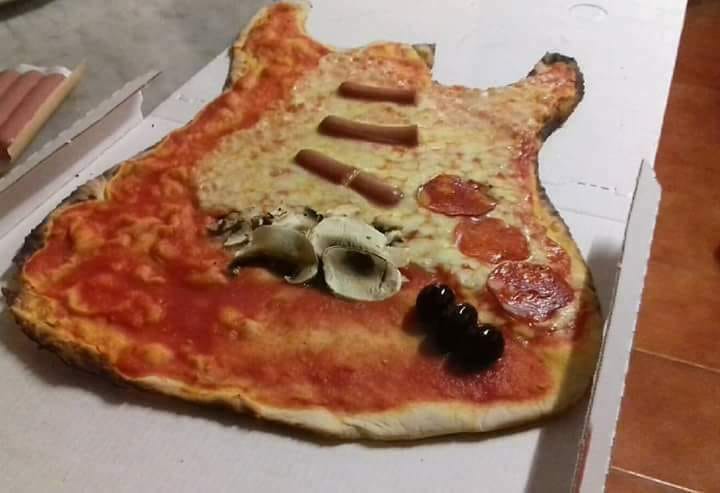 pizza shaped like a guitar