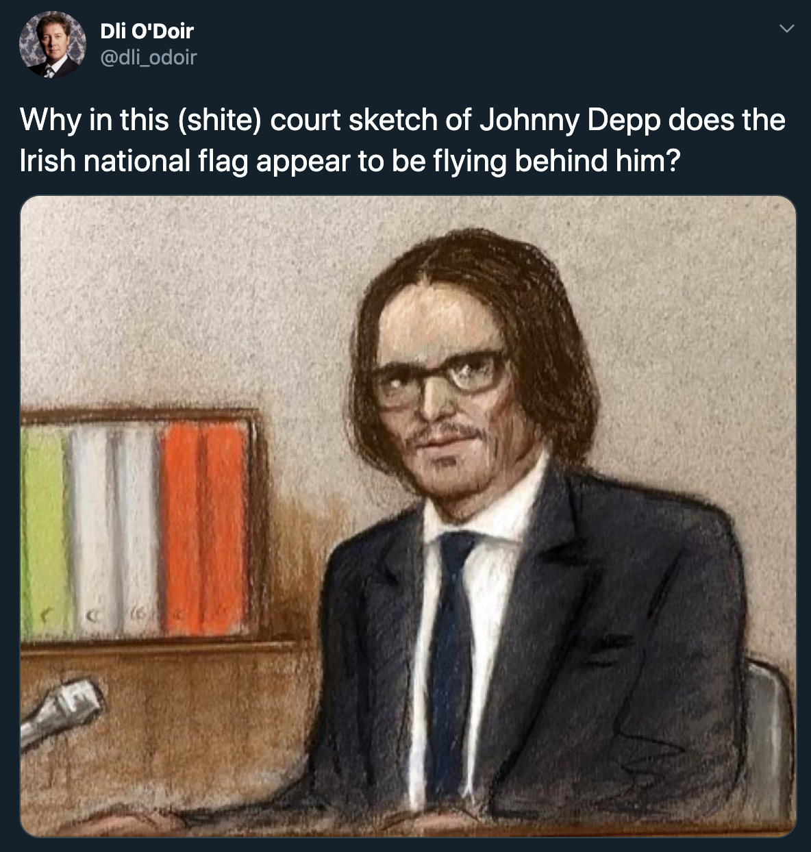 Why in this shite court sketch of Johnny Depp does the Irish national flag appear to be flying behind him?