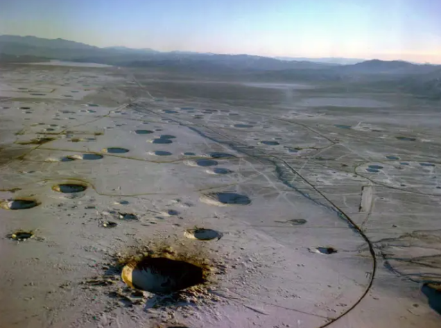crater holes in the Nevada desert from nuclear bomb tests