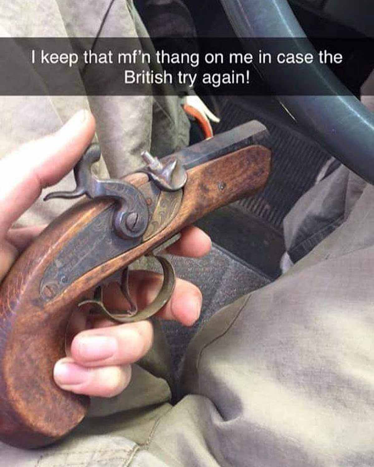 Guy holding a tiny old hand pistol that says 'i keep that mf'n thang on me in case the British try again!'