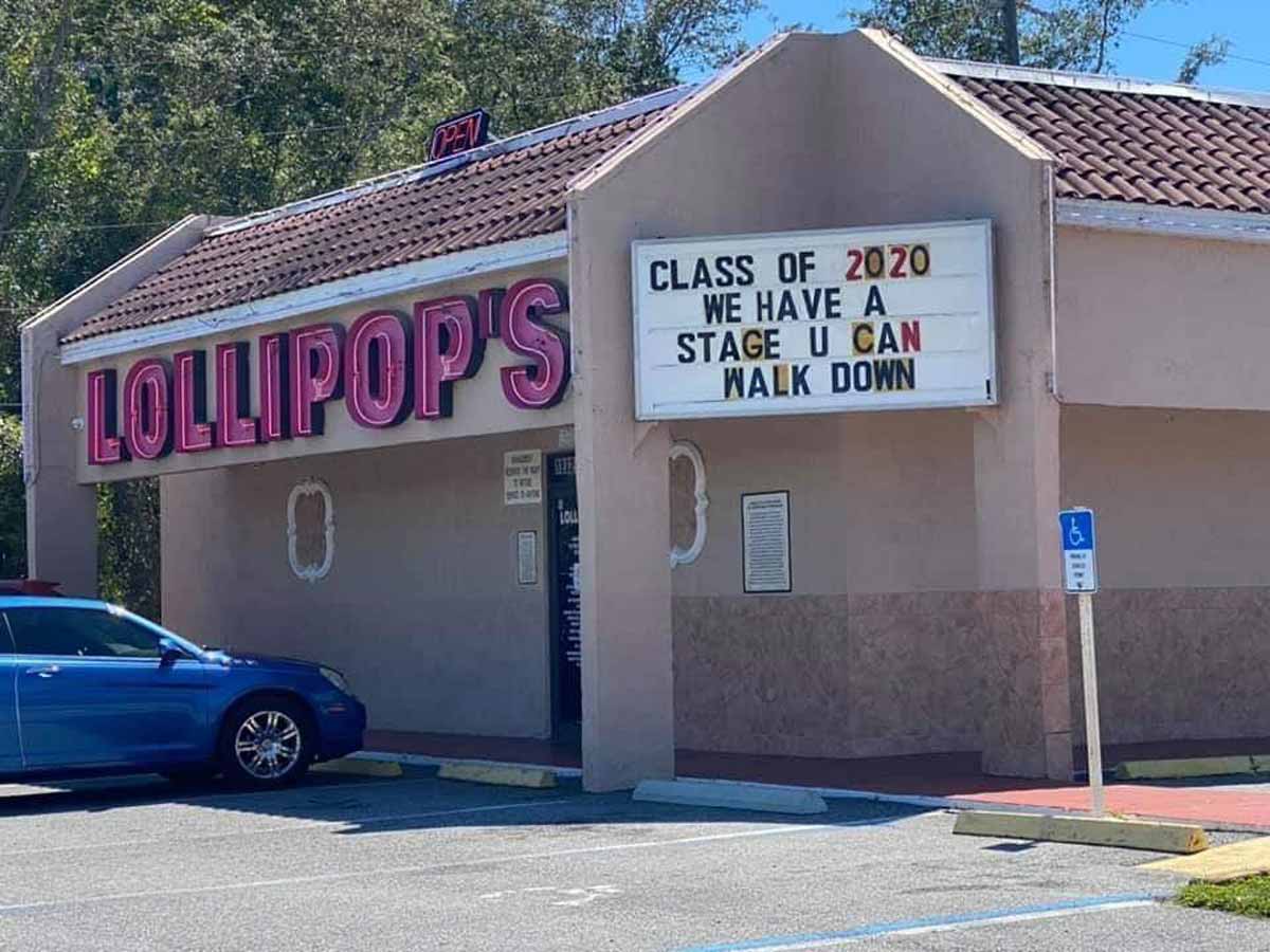 Funny sign outside a strip club called Lollipops that says 'Class of 2020 we have a stage u can walk down'