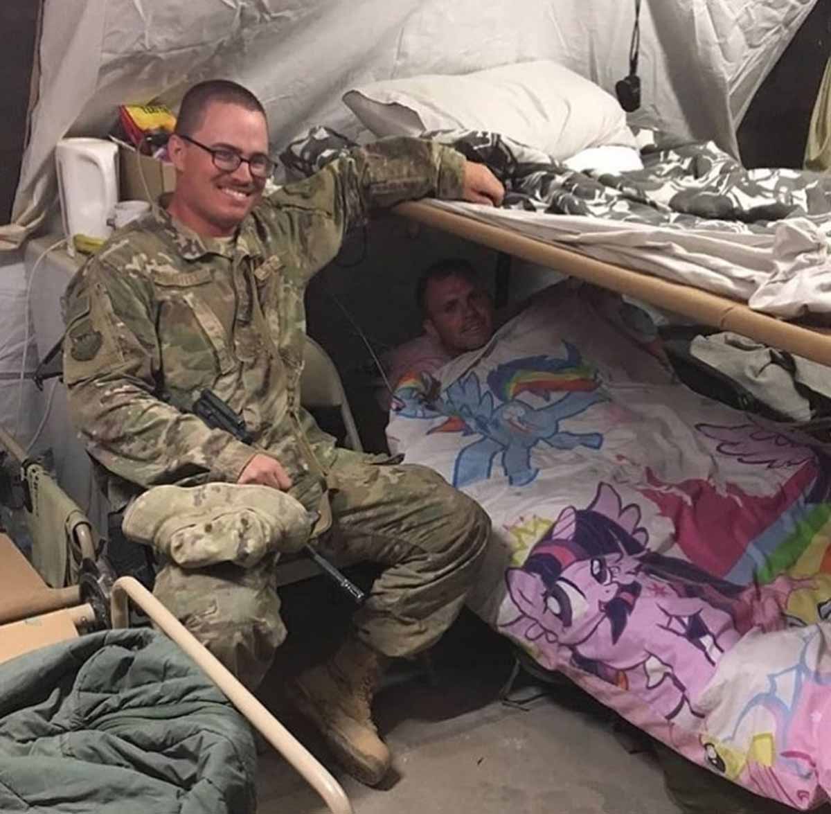 Funny picture of a soldier in his bunk with a my little pony blanket