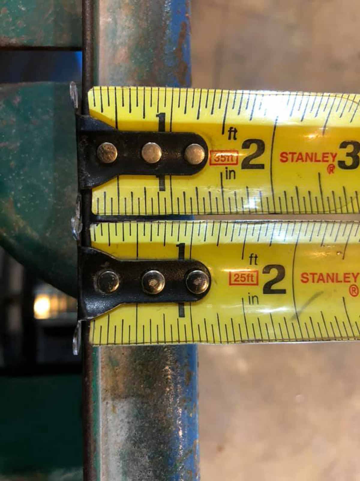 The beginnings of two measuring tapes and the first inch is two different lengths