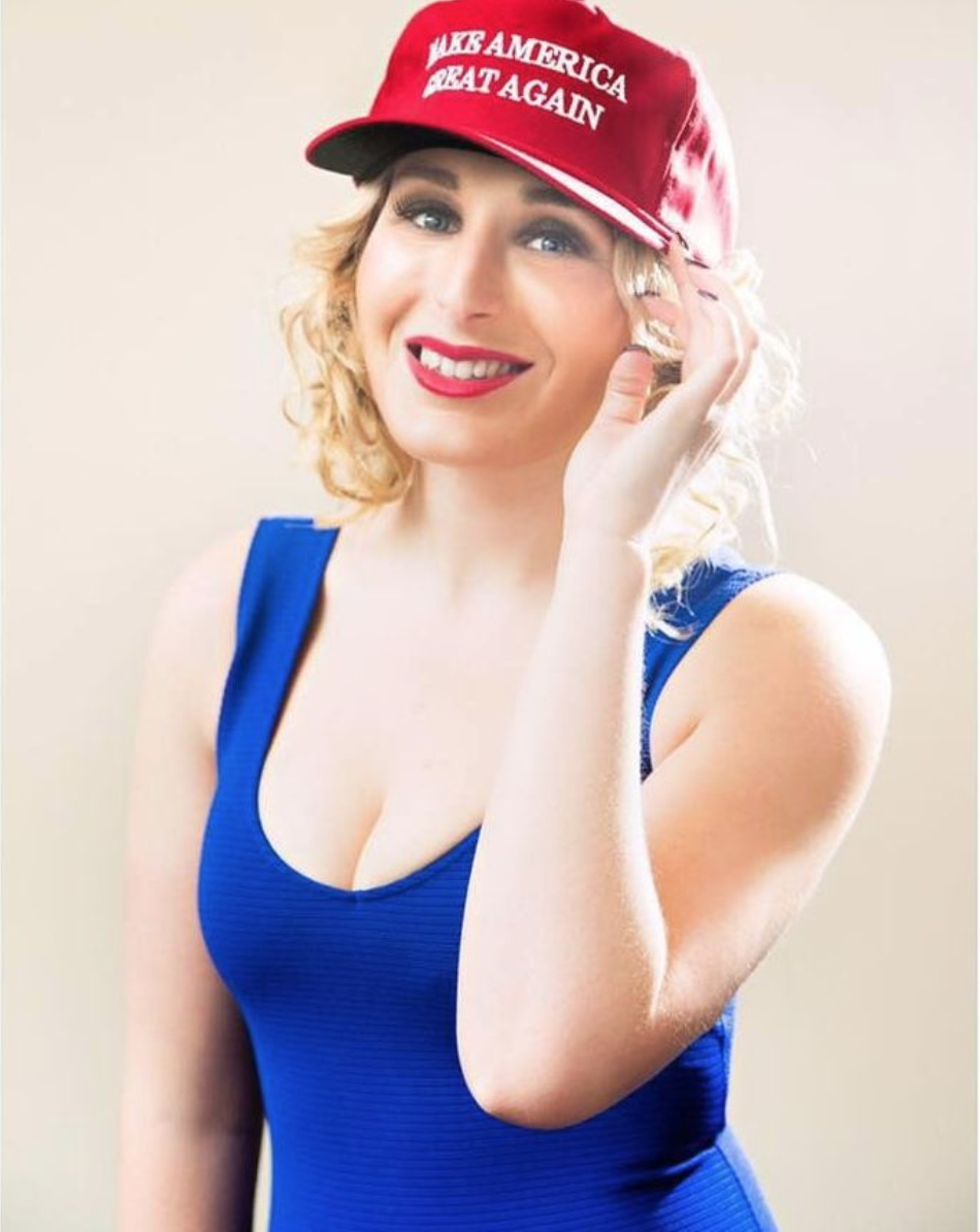 Laura Loomer wearing a red Maga hat and a blue dress pre nose job surgery