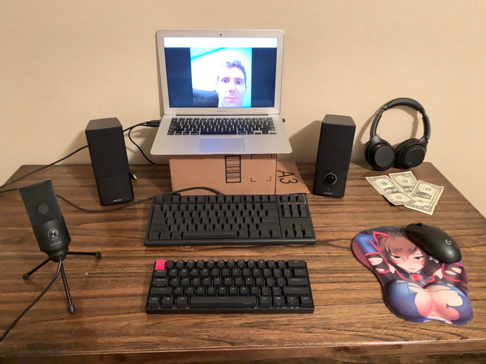gaming setup using mac laptop and three keyboards