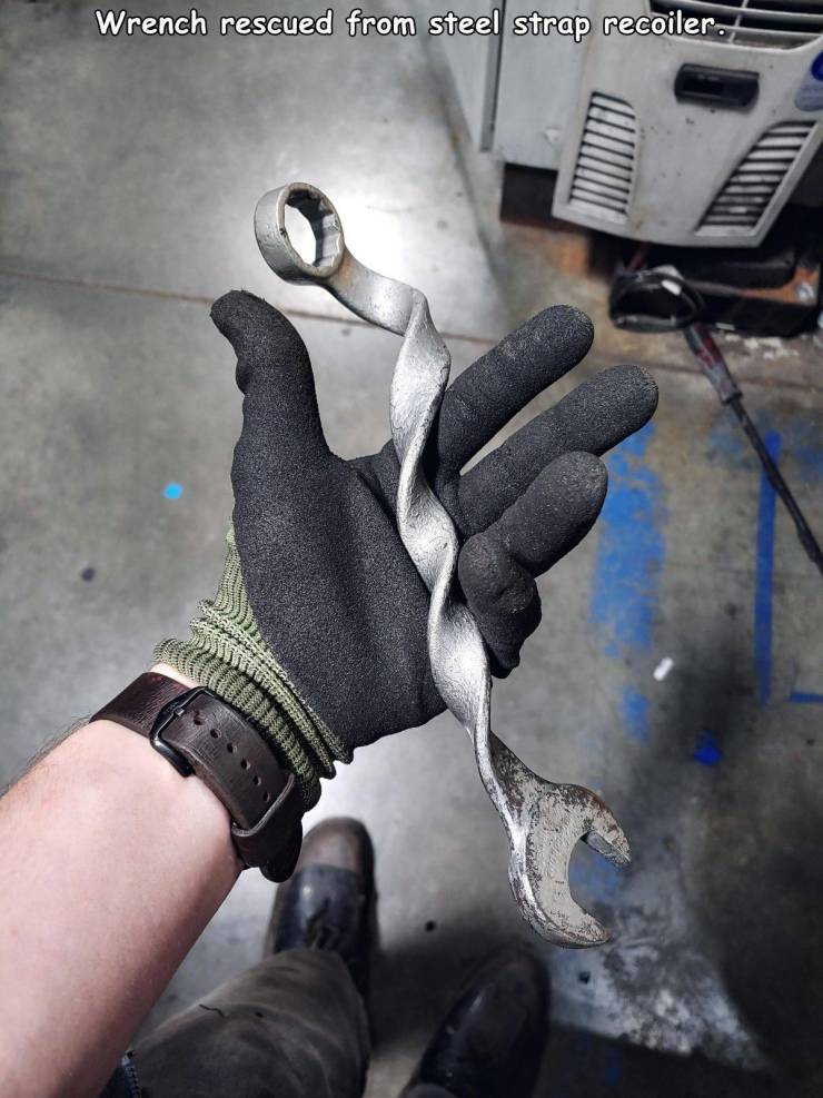 random photos and cool pics - hand - Wrench rescued from steel strap recoiler.
