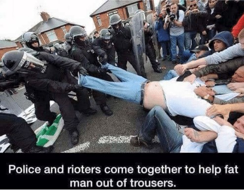teamwork-memes-funny rioters - i Police and rioters come together to help fat man out of trousers.