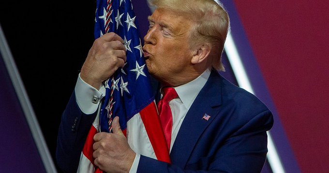 donald trump hugging flag