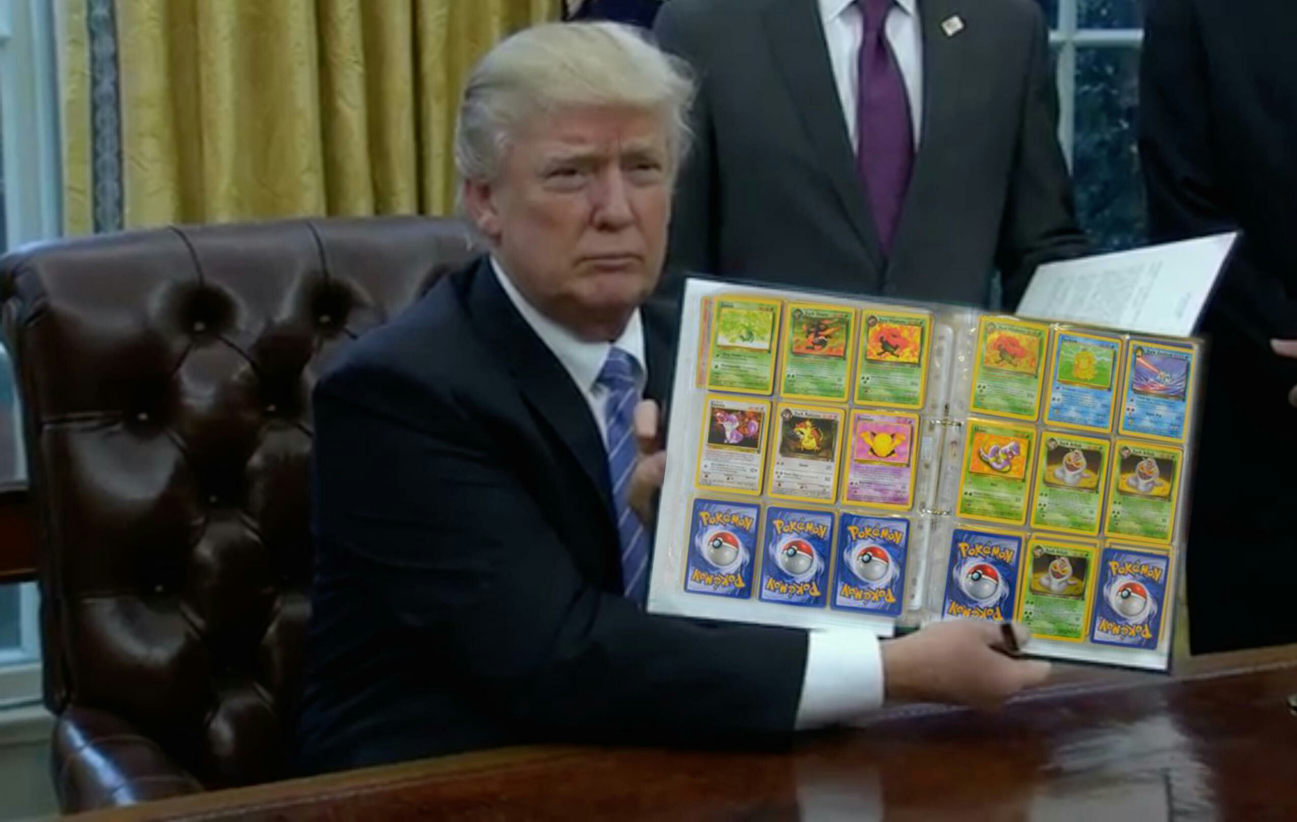 Donlad trump holding up a notebook of pokemon cards