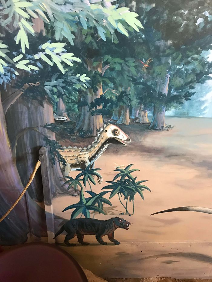 fascinating photos - A DeLorean hiding in the background of a painting in the Dinosaur exhibit.