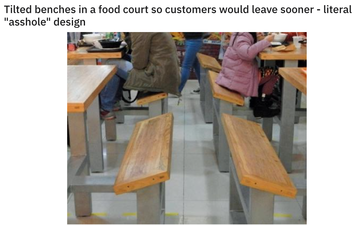 funny design fails - table - Tilted benches in a food court so customers would leave sooner literal