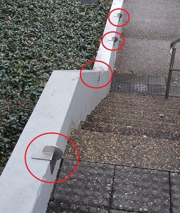 These metal discs are placed in places to prevent people from skating / biking / grinding on these walls / areas.