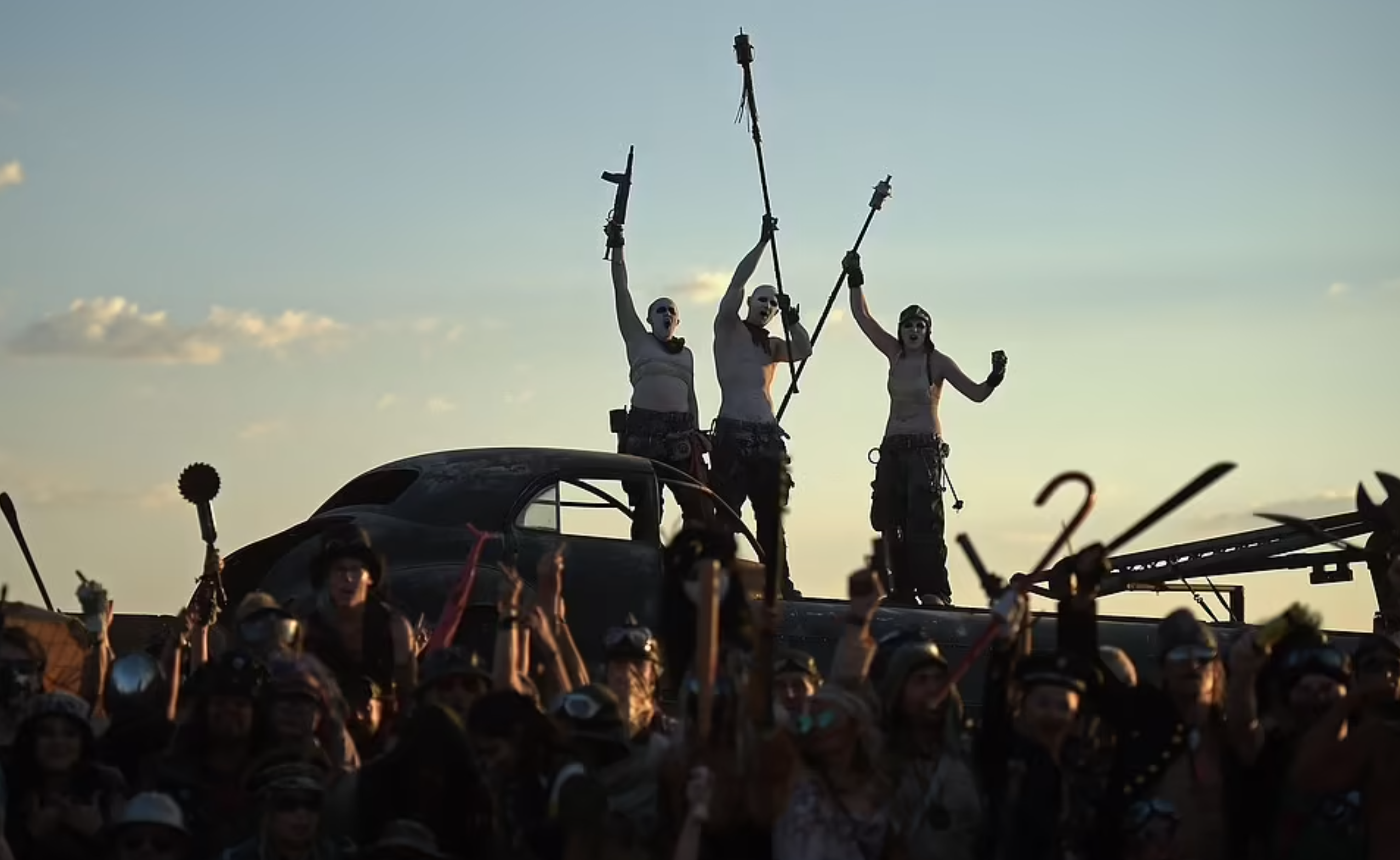 pictures from wasteland weekend - - crowd of people on top of a car
