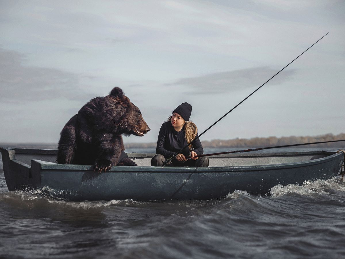 monday morning randomness - russian woman fishing with bear