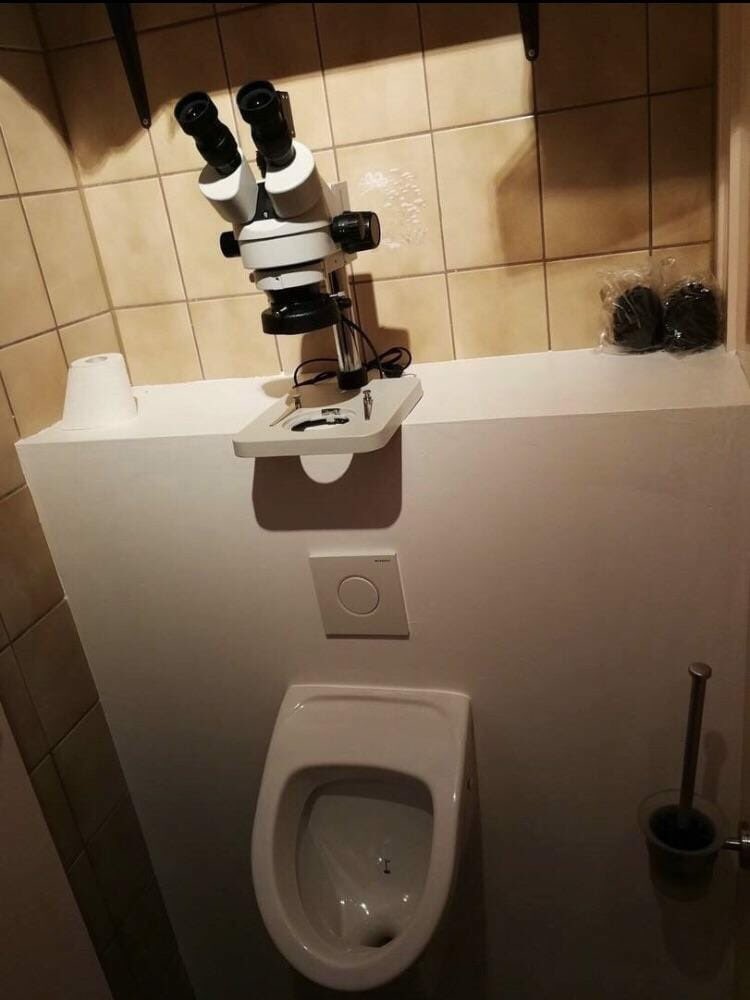 threatening bathrooms - toilet with microscope - C