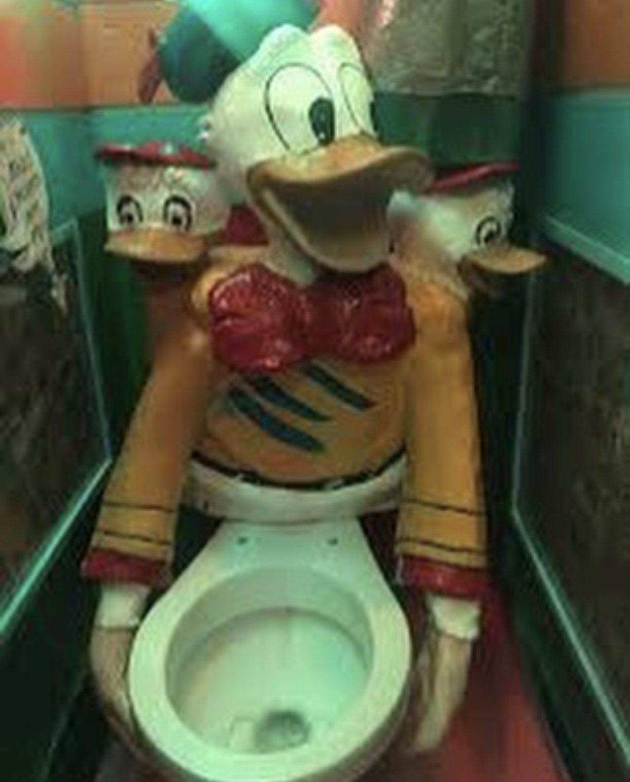 threatening bathrooms - donald duck toilet