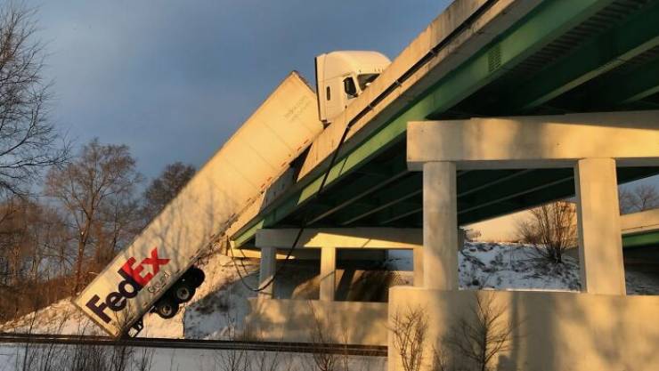 "FedEx Truck Hanging Off The Indiana Toll Road After Hitting Ice In Frigid Conditions. Driver Not Hurt"