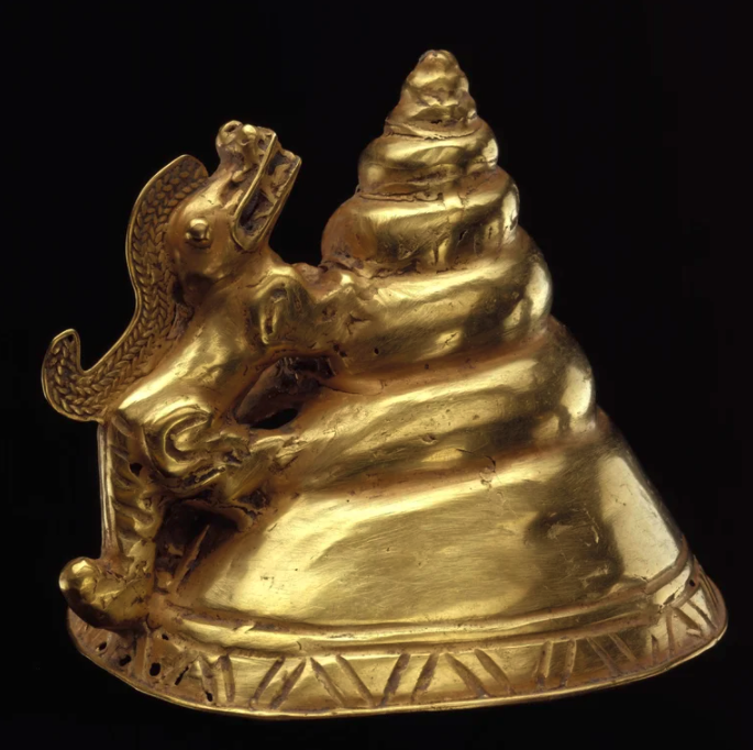 artifacts from history  - Gold genital cover shaped like a shell with a reptile. Colombia, Tairona culture, 500-1550 AD