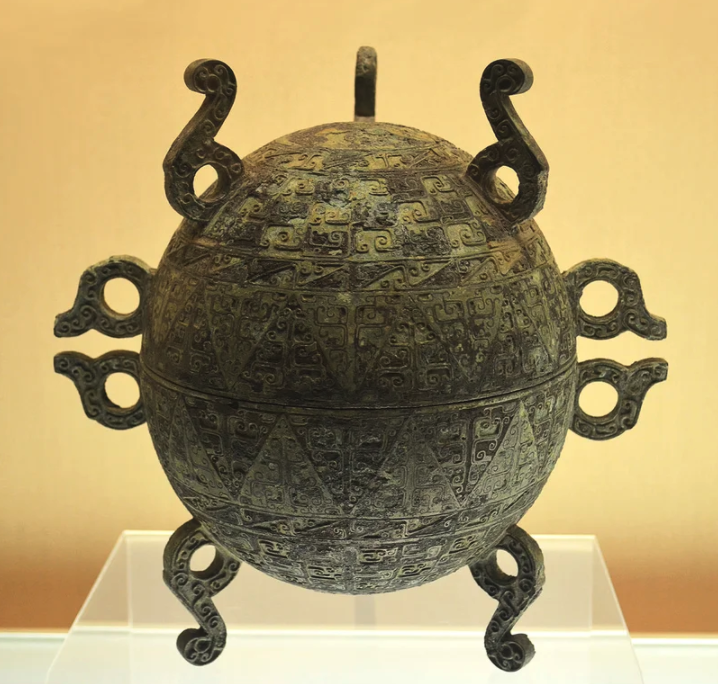 artifacts from history  - Bronze ritual food vessel made of two hemispherical parts, originally gilded. China, Warring States, 5th-3rd century AD