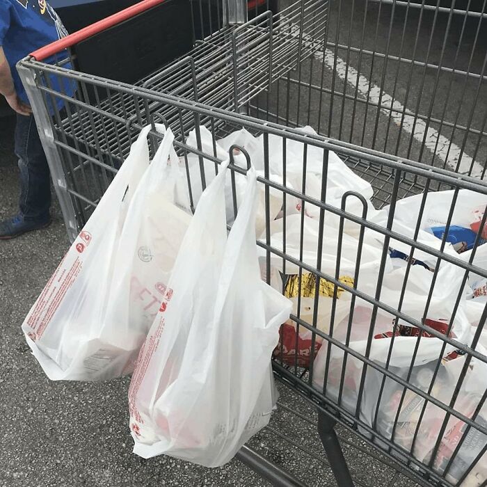 There are loops on shopping carts that can be used to hold your grocery bags, keep them upright if they have fragile items, or store extra if you’ve got a lot of groceries.