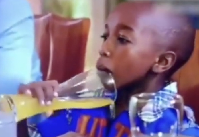 Kids Being Weirdos - black kid drinking orange juice