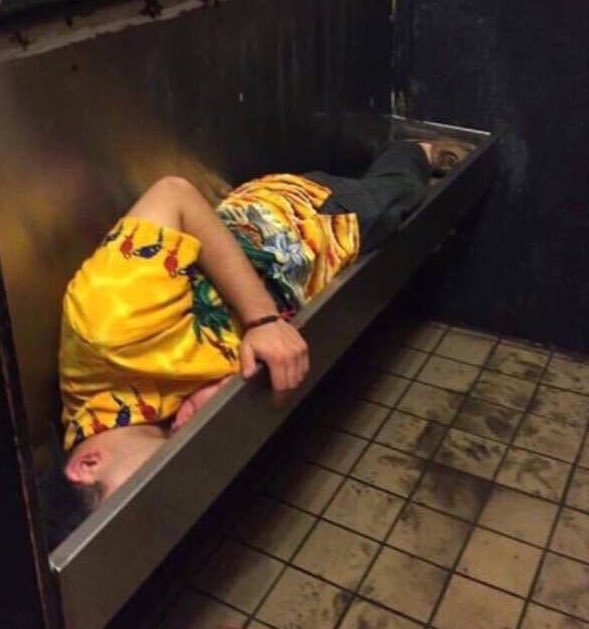 Chaotic Nightclub Photos - guy sleeps in urinal