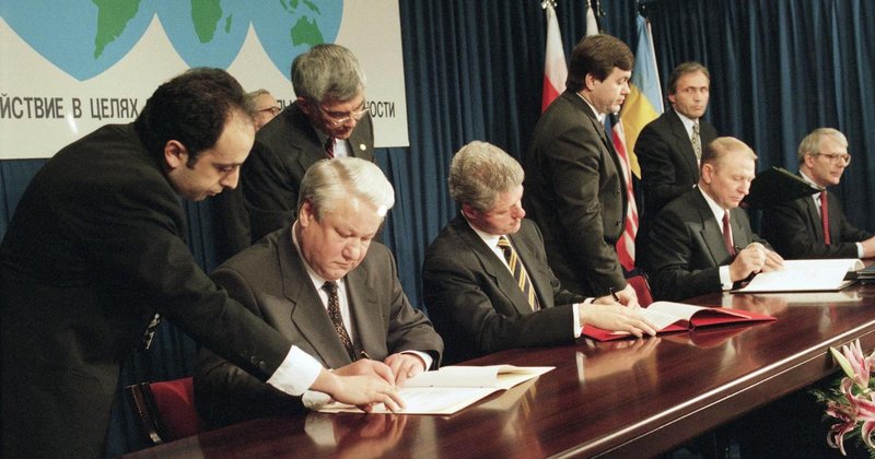 Russia and the US signs a treaty where Ukraine is giving up their nuclear weapons in exchange for security assurances in 1994.