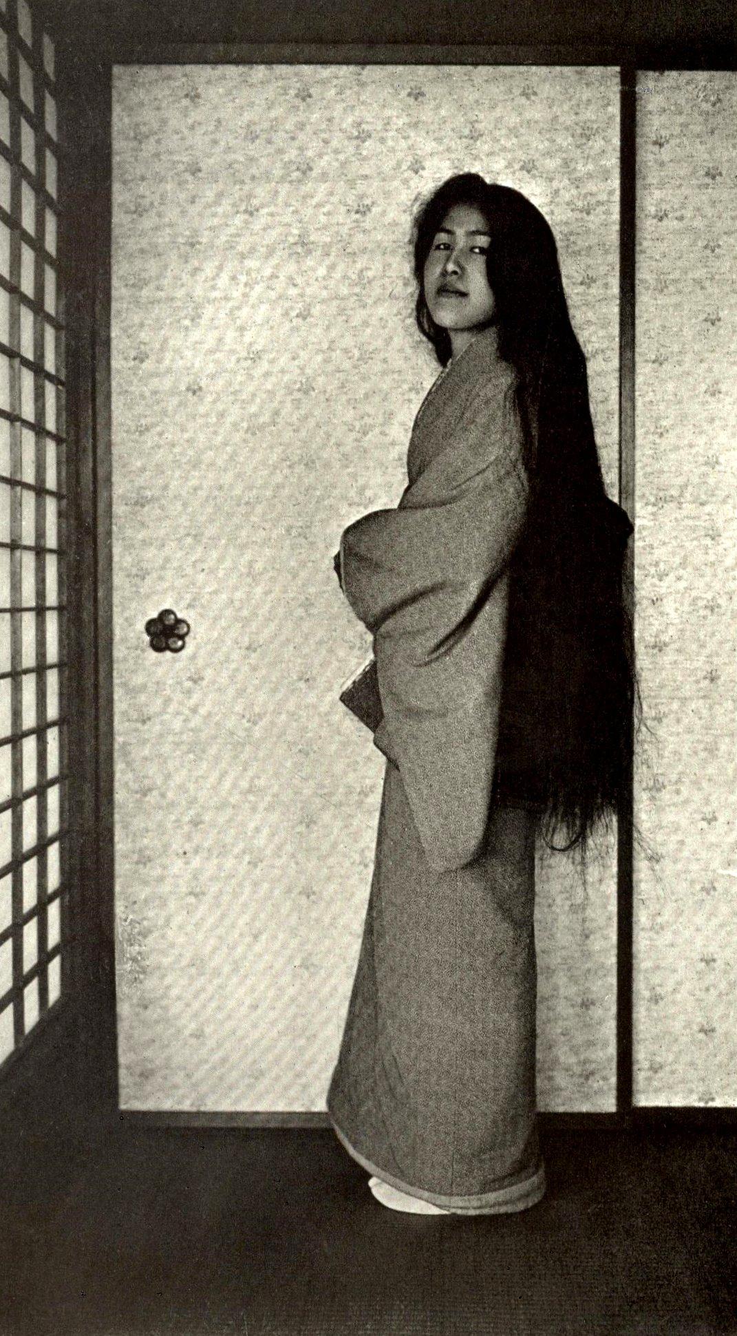 A Geisha after washing her hair and before styling it, c. 1905.