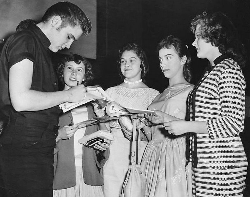 Girls getting an autograph from Elvis, 1956