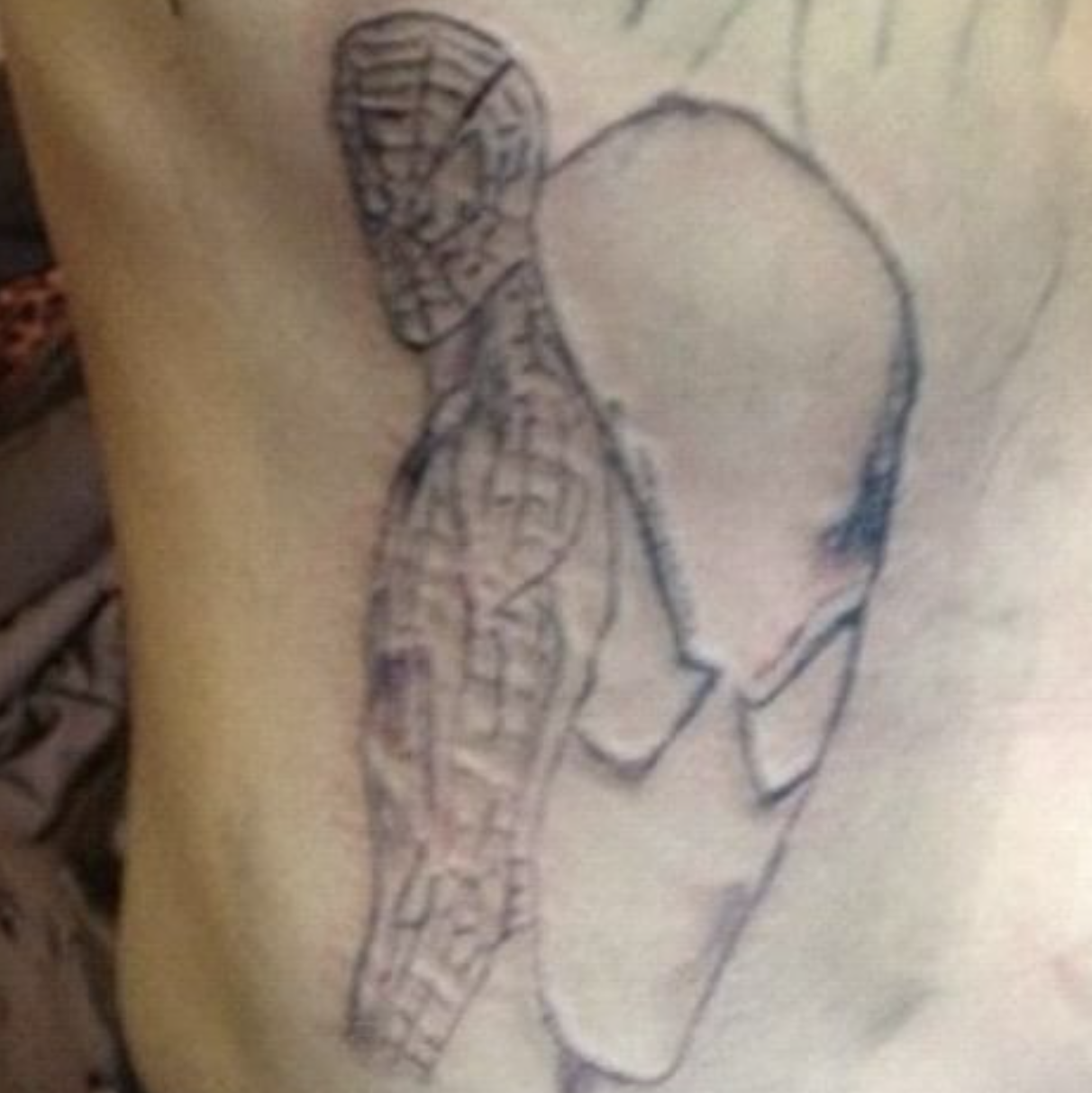 Bad Tattoos - bad spider man tattoo
