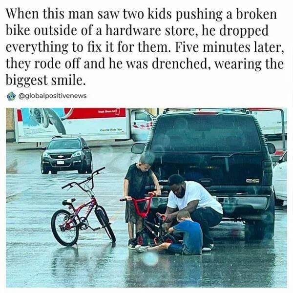 wholesome pics - black man fixes kids bike in rain - When this man saw two kids pushing a broken bike outside of a hardware store, he dropped everything to fix it for them. Five minutes later, they rode off and he was drenched, wearing the biggest smile.