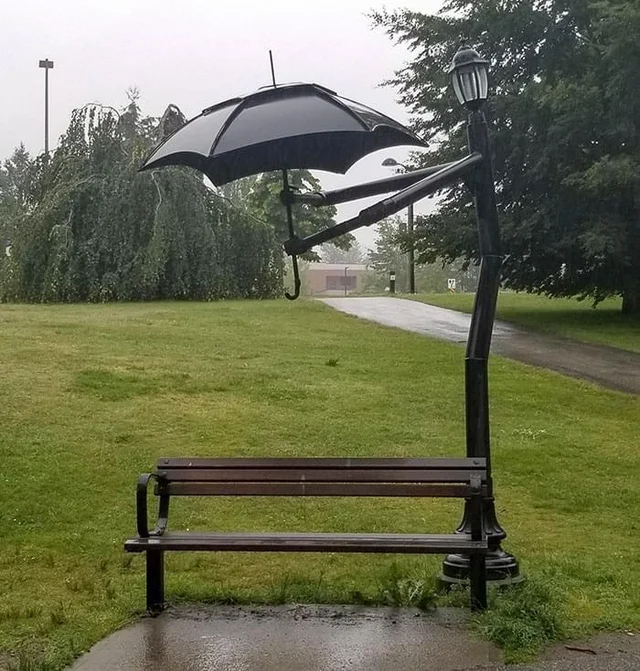 wholesome - uplifting - lamp post holding umbrella